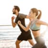 Fitness couple running on bridge side | South Ogden, UT | Timeless Med Spa